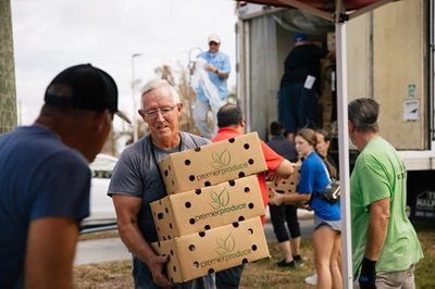 Hurricane Ian volunteers unloading a truck.