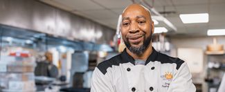 A chef standing in a kitchen